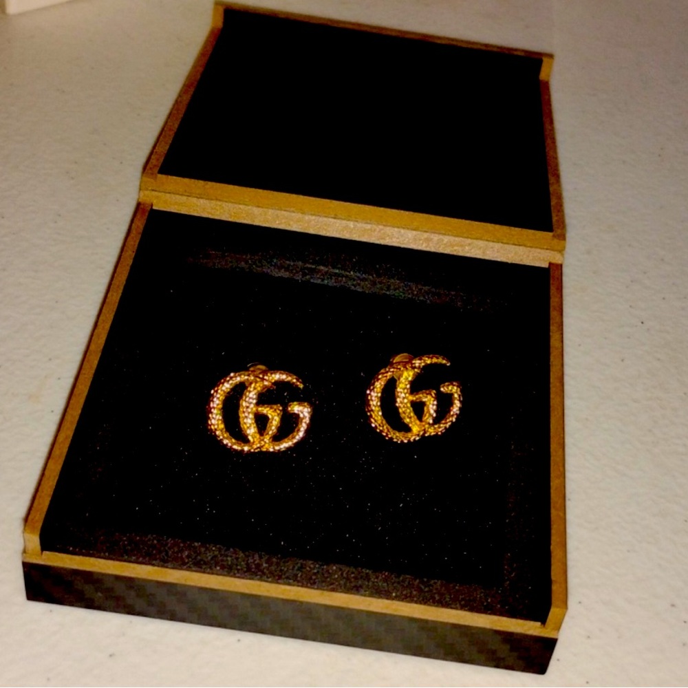 GG gold tone earrings